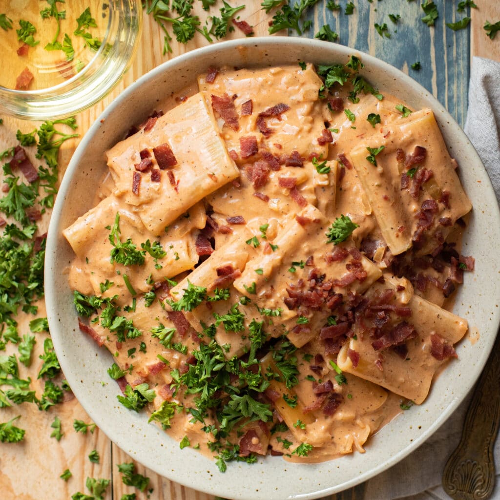 Pasta with Creamy Blush Sauce, topped with bacon and parsley