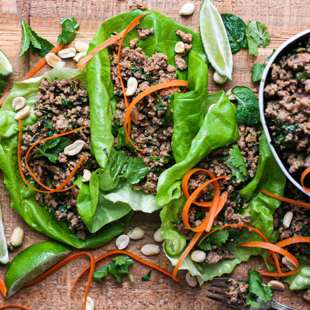 three lettuce wraps filled with ground turkey