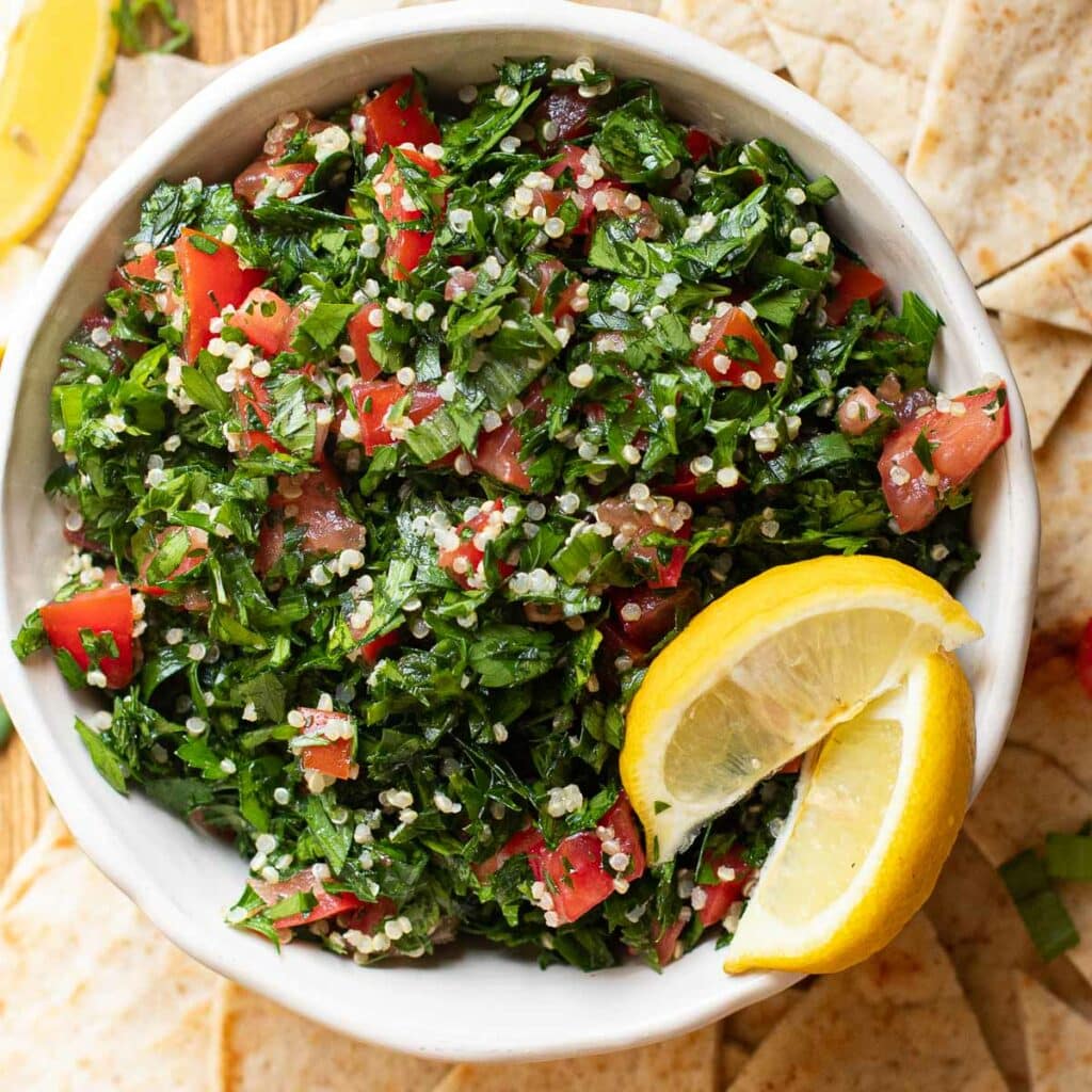 Tabouli Salad with Quinoa , garnished with lemon wedges