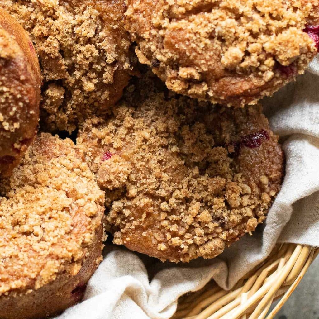 A basket full of Apple Butter Muffins with Streusel topping