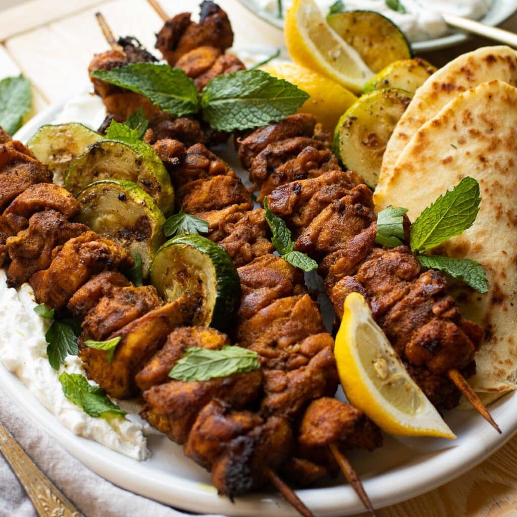 chicken shawarma with grilled zucchini and lemons