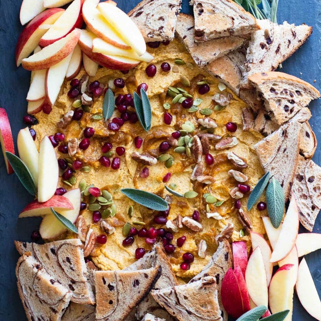 Butter Board recipe with pumpkin spice, cinnamon toast, sage leaves and pomegranate seeds