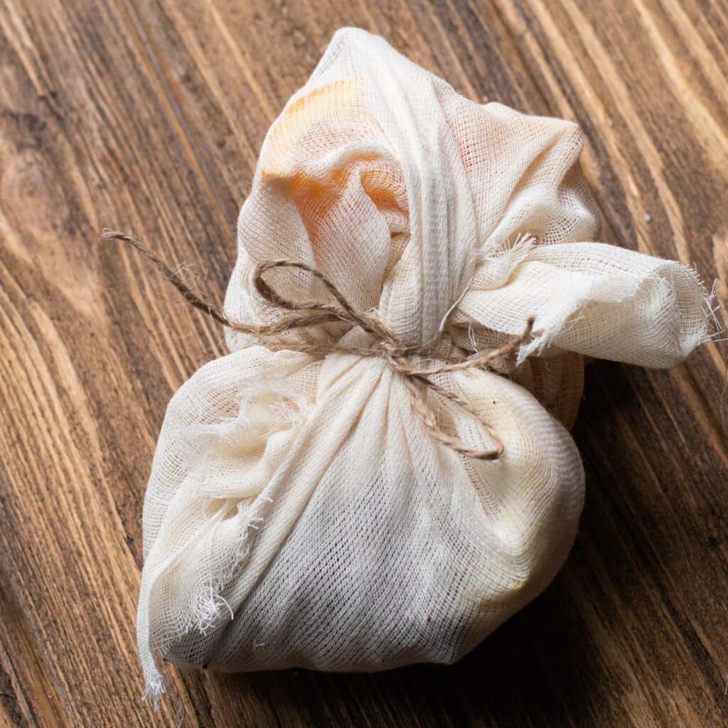 A satchel of mulling spices made from cheesecloth