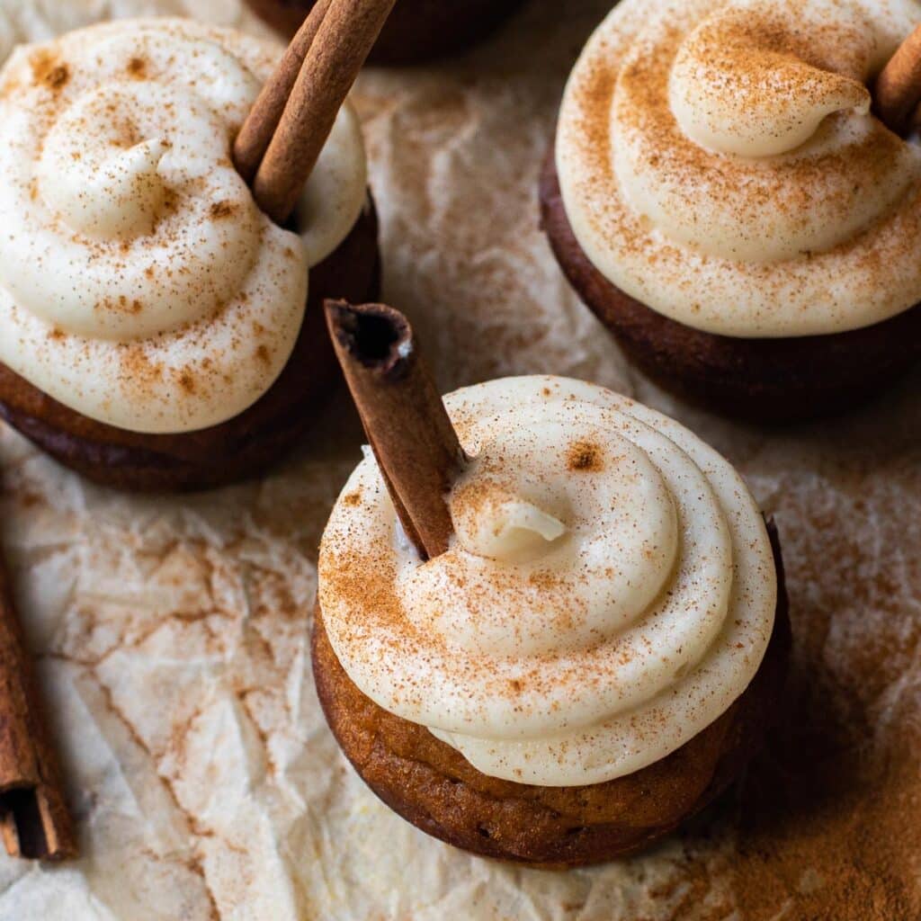 Maple cream cheese frosting dusted with cinnamon