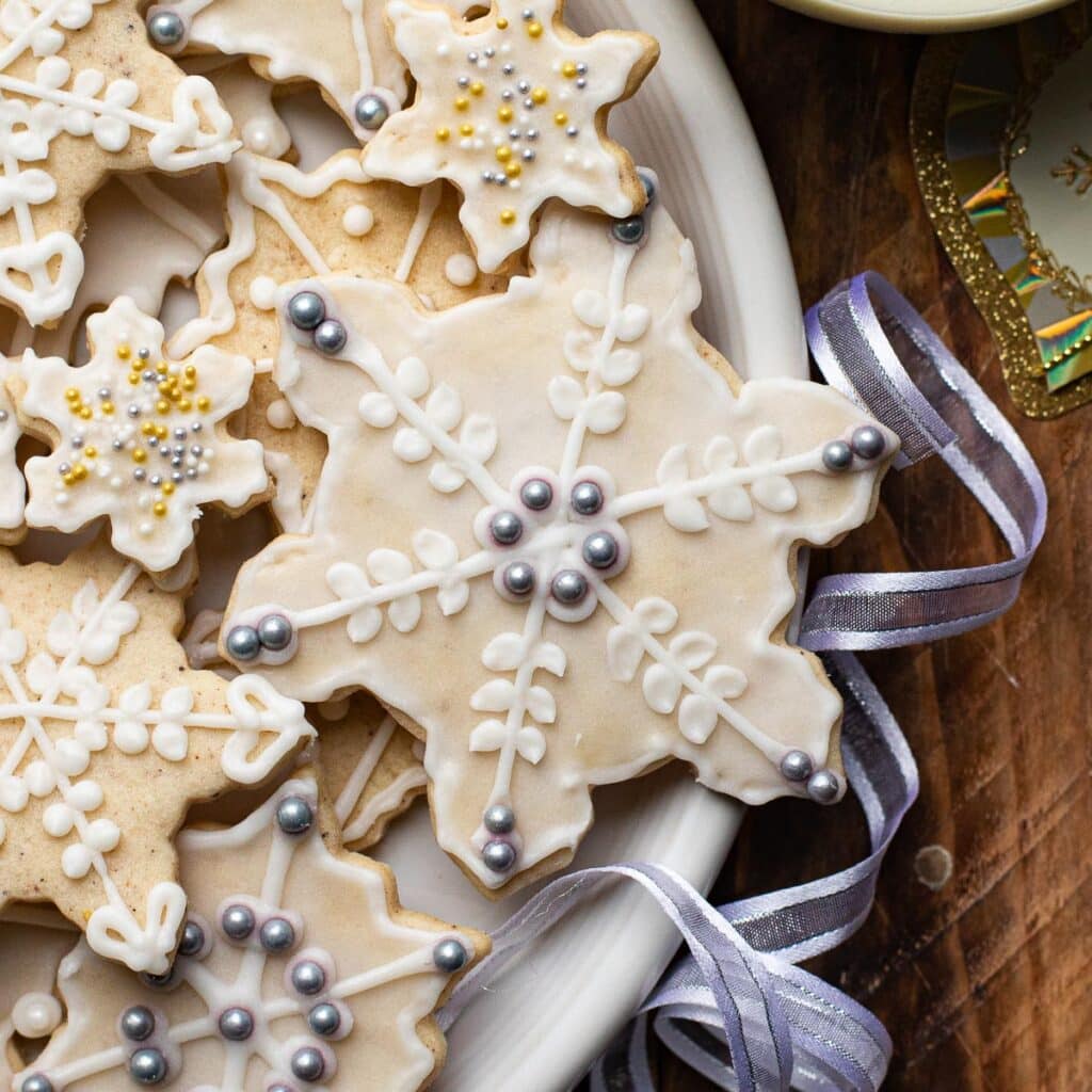 Eggnog Cut-Out cookies decorated with silver sugar sprinkles