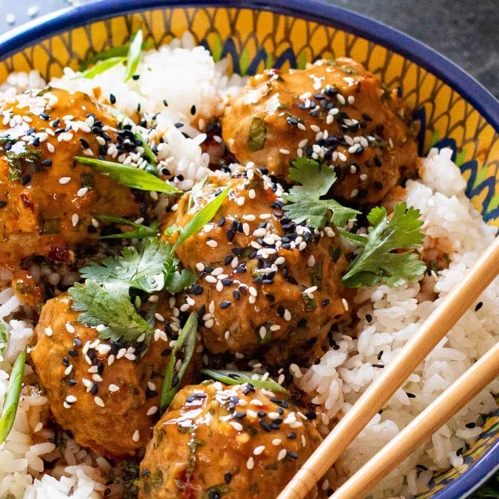 Asian chicken meatballs over white rice