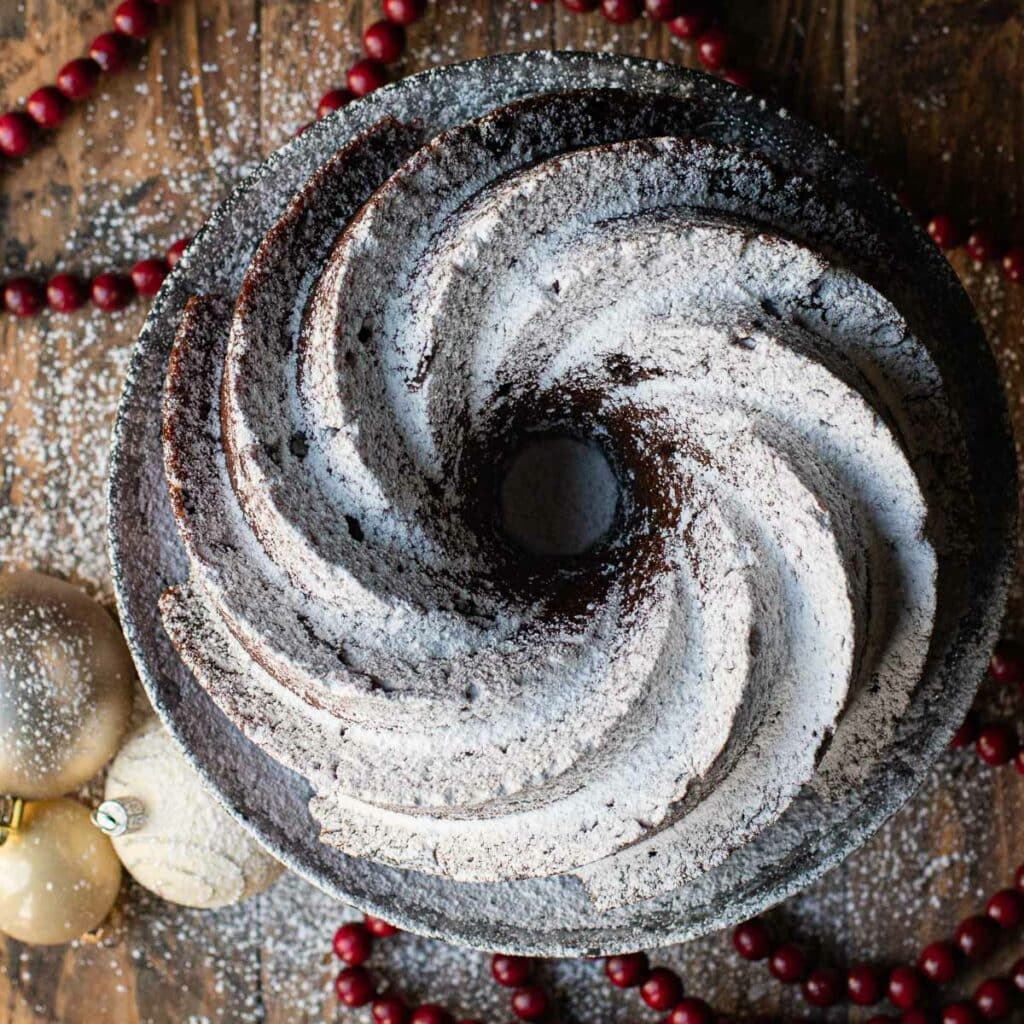 Top down view of Holiday Spice Cake with powdered sugar on top
