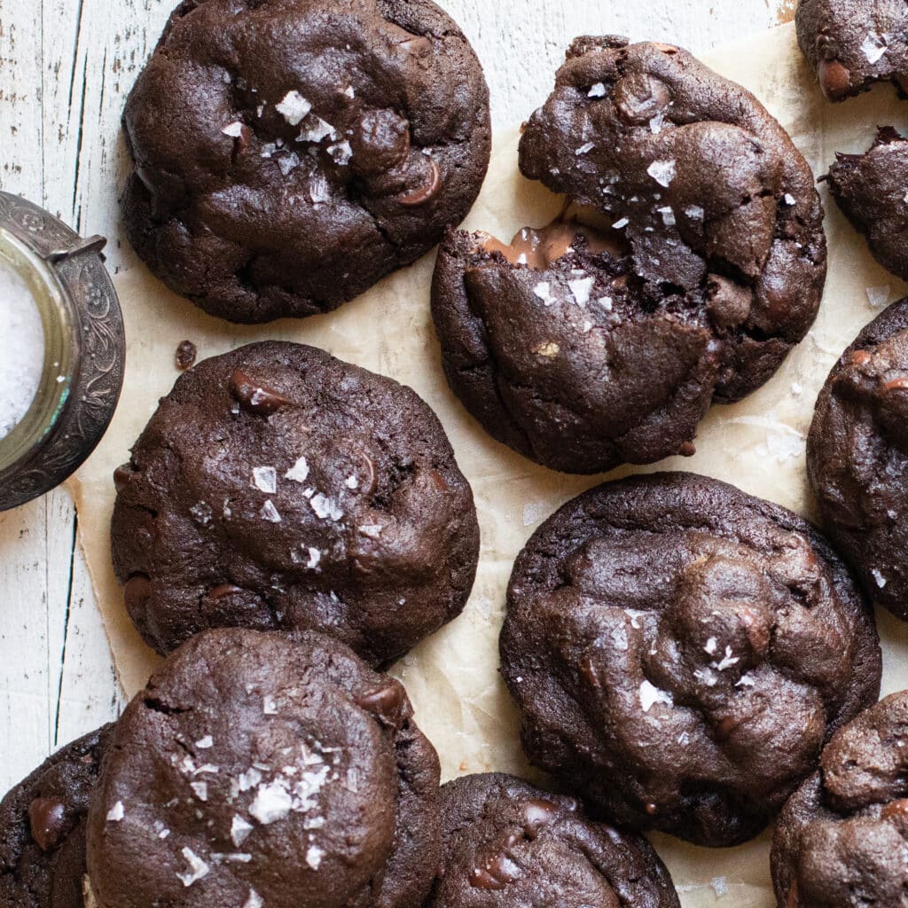 Salted Caramel Chocolate Cookies on a piece of parchment paper