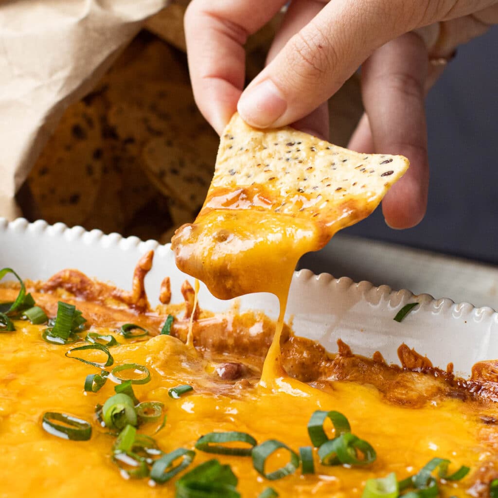3 Ingredient Chili Cheese Dip on a tortilla chip