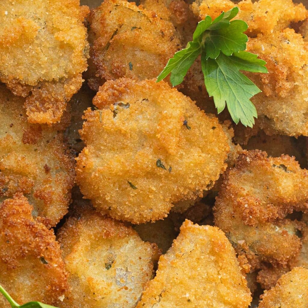 Fried pickles garnished with fresh parsley