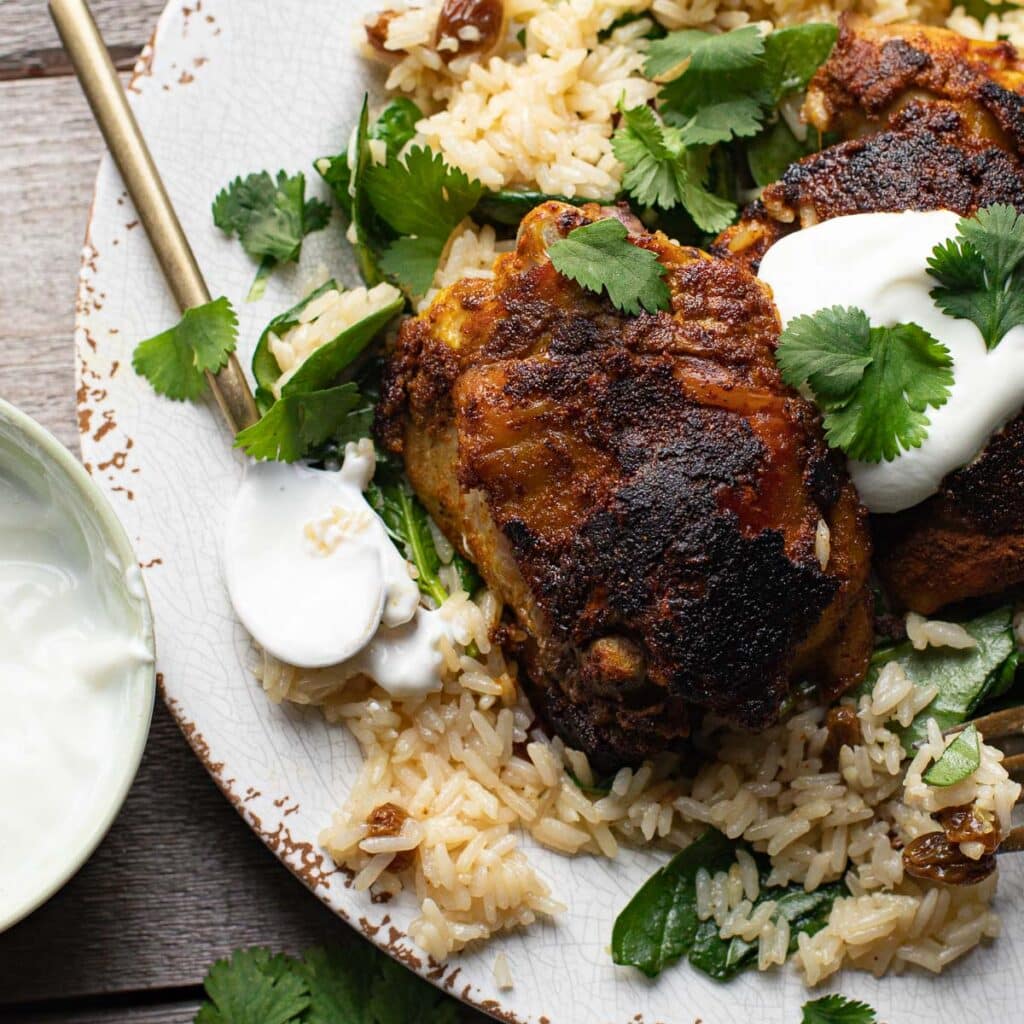 Indian Ginger Chicken with citrus cream over a bed of rice