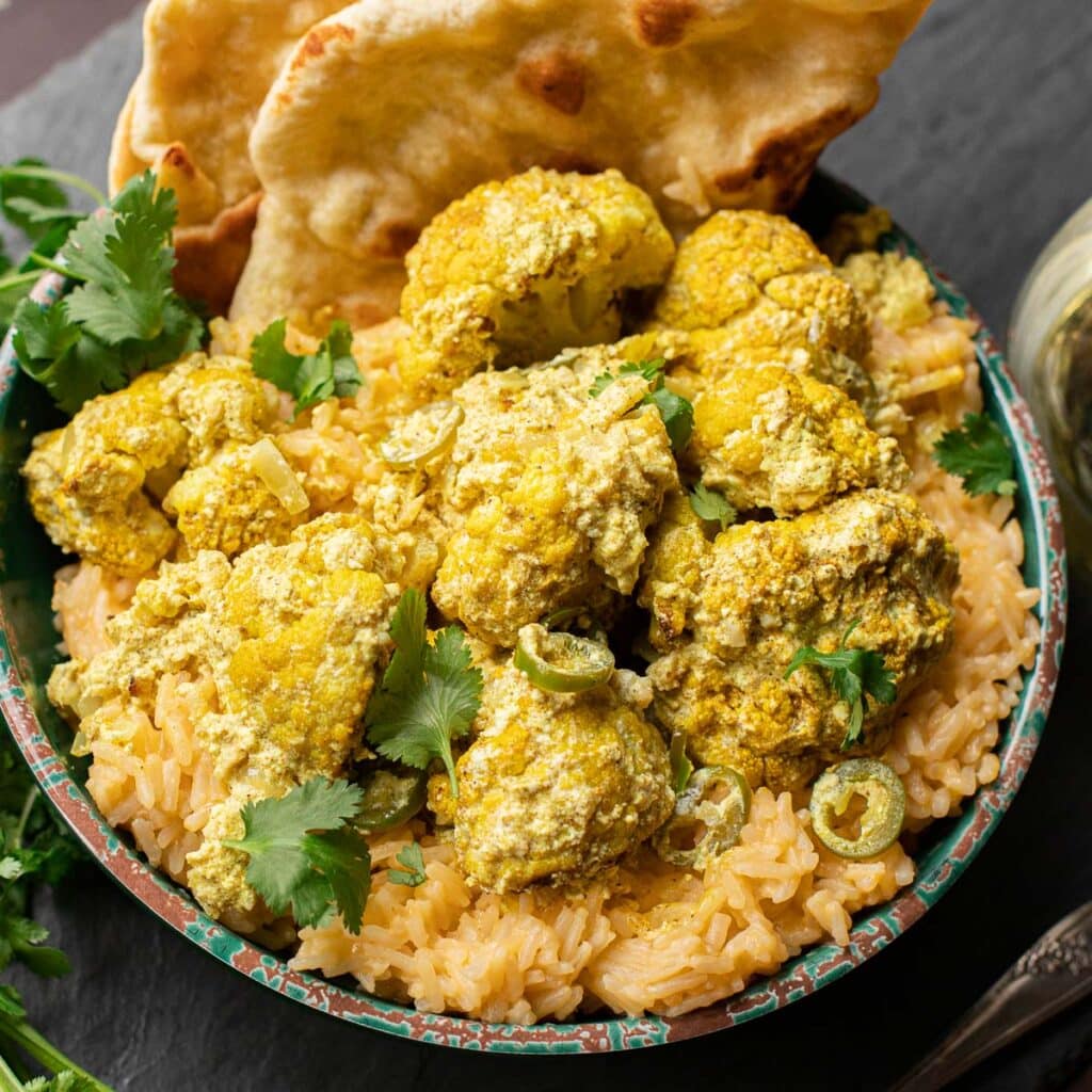 Roasted cauliflower in an Indian curry sauce over rice