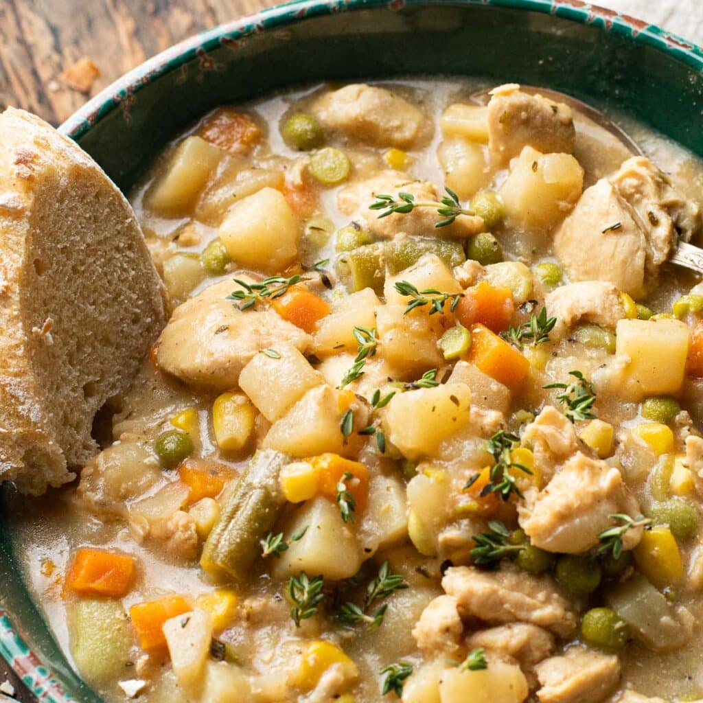 Chicken stew with corn, carrots and peas