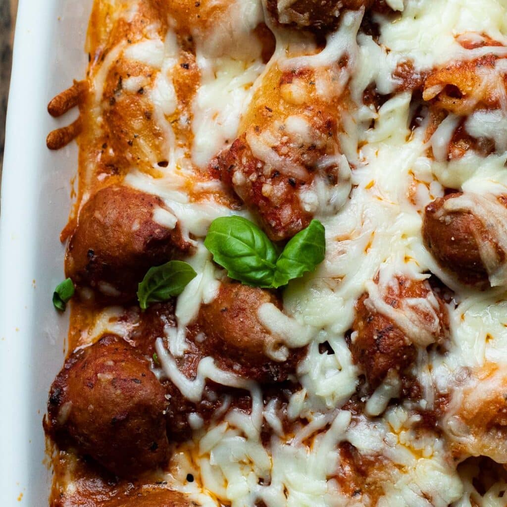 Turkey Sausage and pasta topped with mozzarella cheese and basil