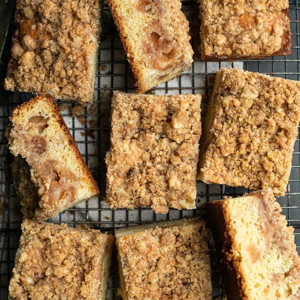 Apple Cinnamon Sour Cream Coffee Cake, cut into squares on a wire rack