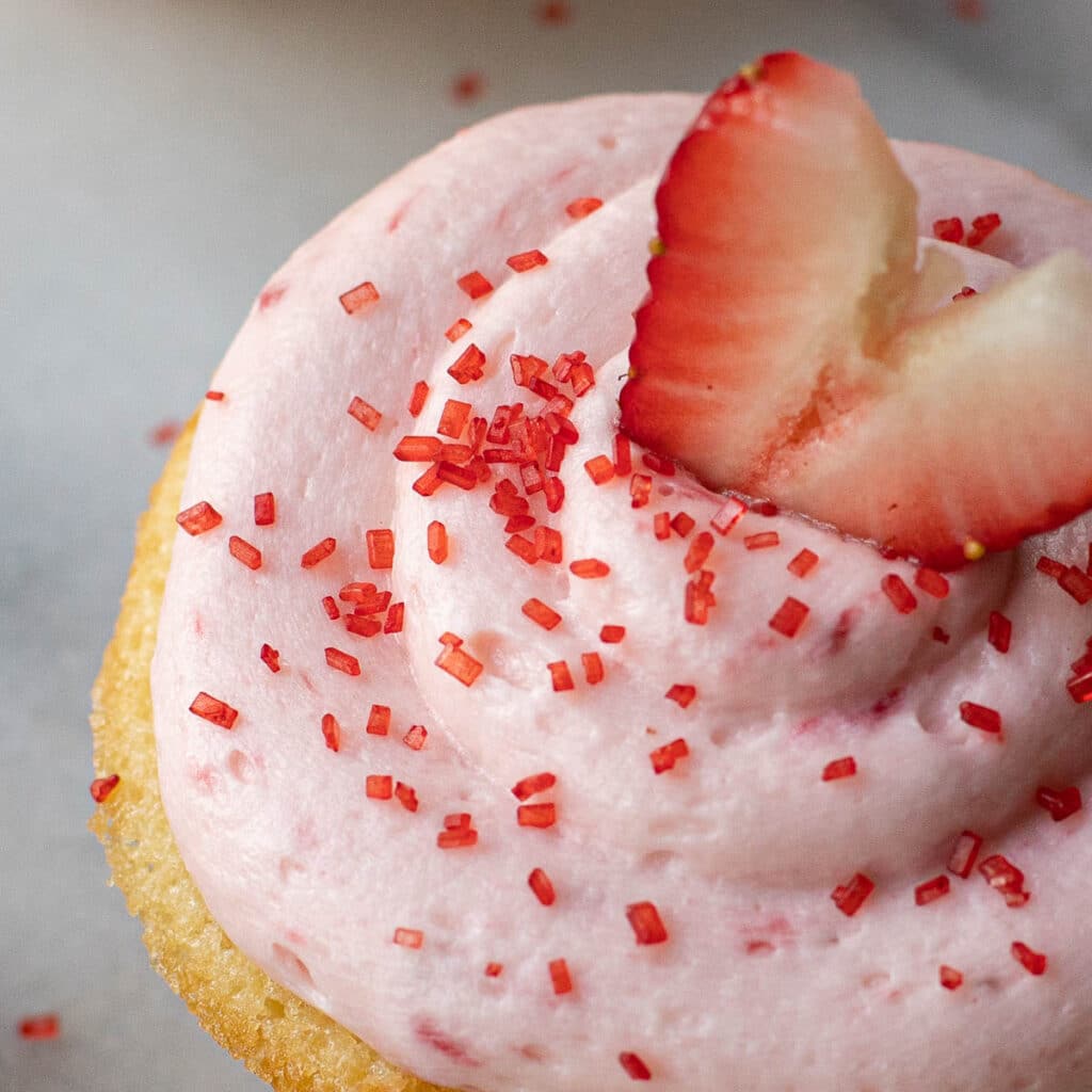 Strawberry Frosting topped with red sprinkles