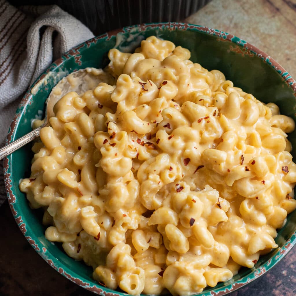 Gluten free slow cooker mac and cheese in a green bowl