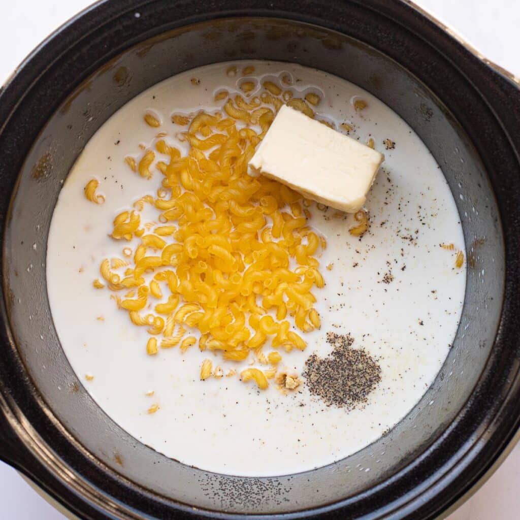 Macaroni, butter, milk and black pepper in a crock pot