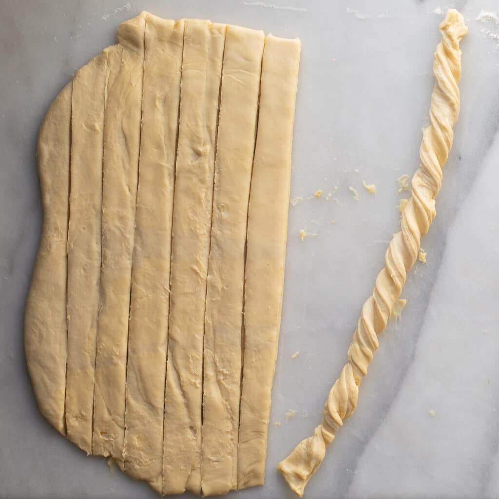 Strips of pastry dough with one strip twisted