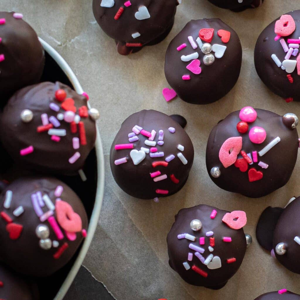 Chocolate covered peanut butter balls decorated for Valentine's Day