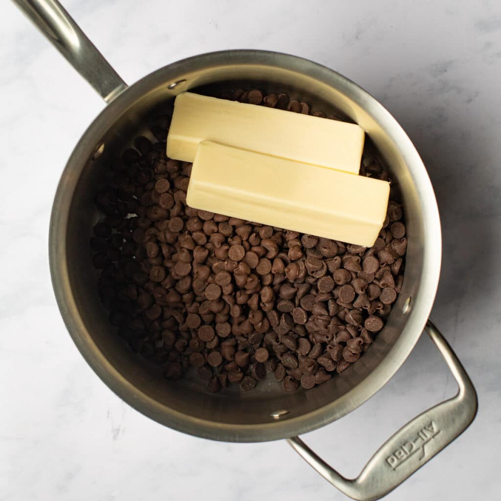 chocolate chips and 2 sticks of butter in a stainless steel saucepan