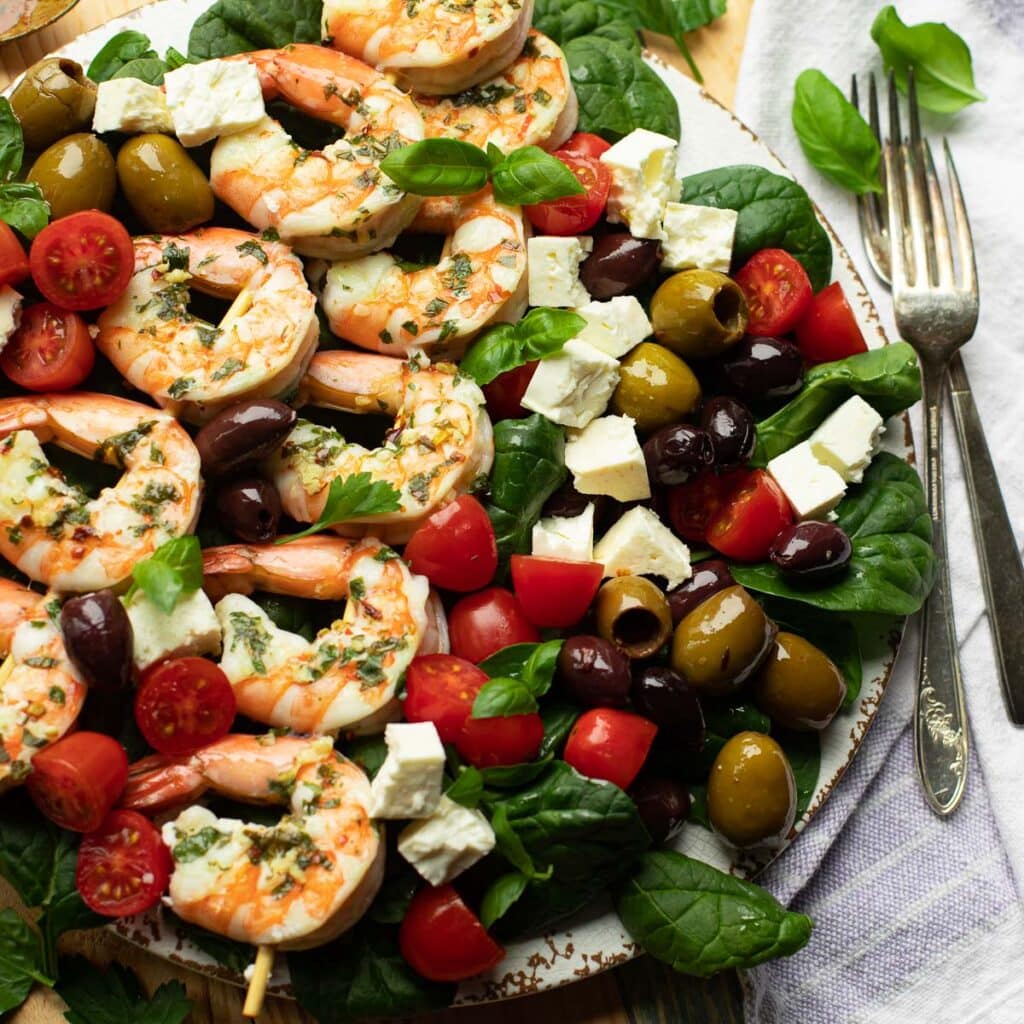healthy mediterranean shrimp salad with tomatoes, olives and feta cheese