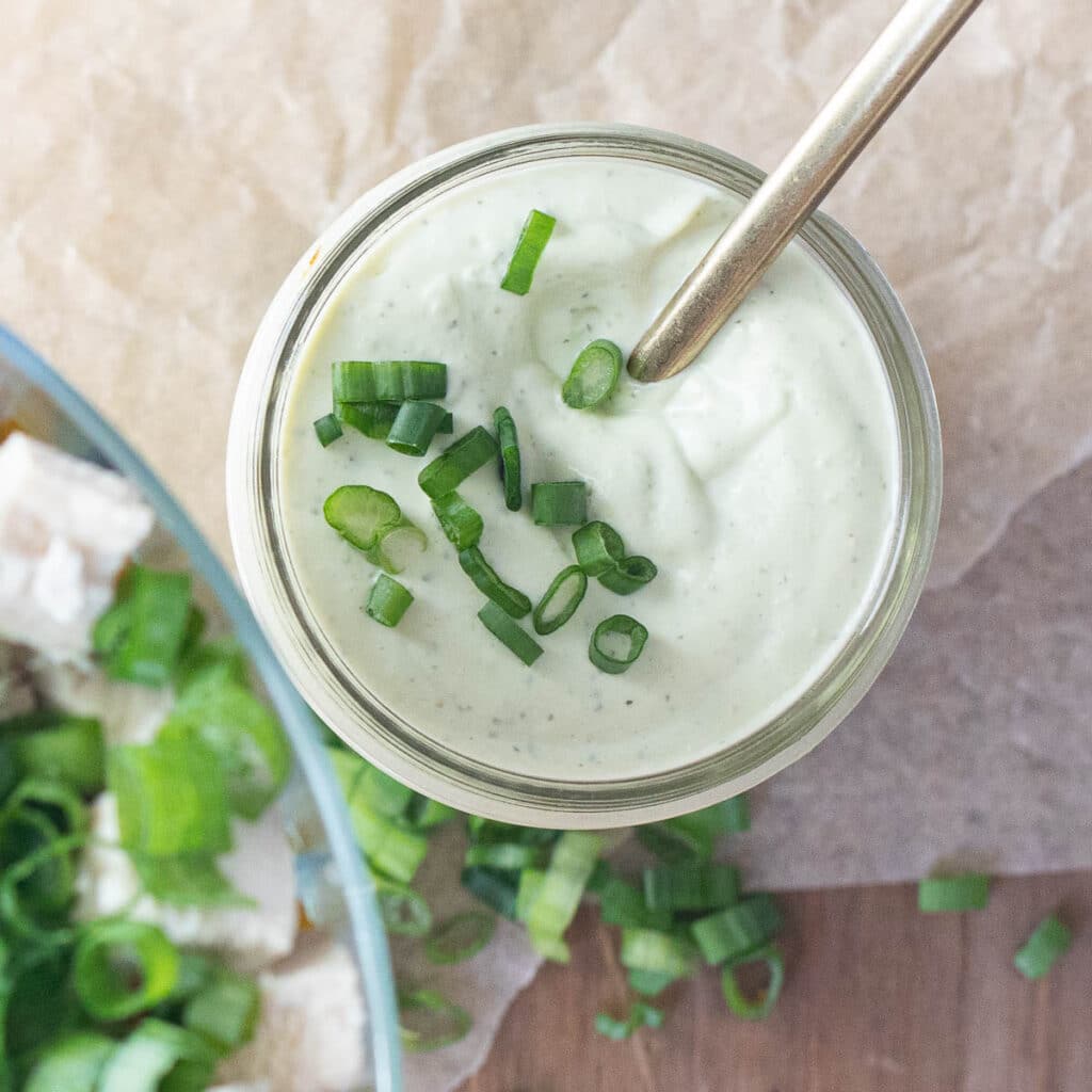 avocado lime ranch dressing garnished with chopped scallions