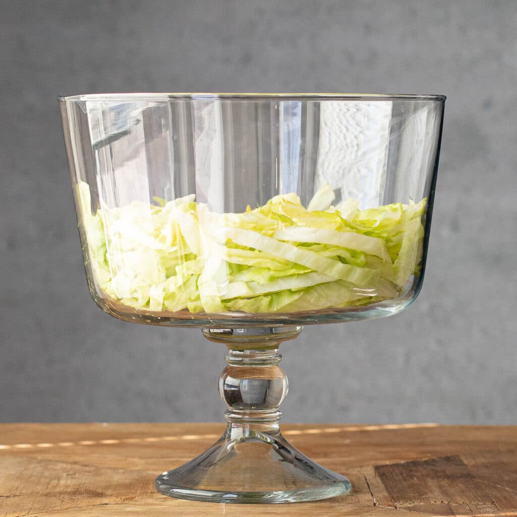 shredded iceberg lettuce in a trifle dish