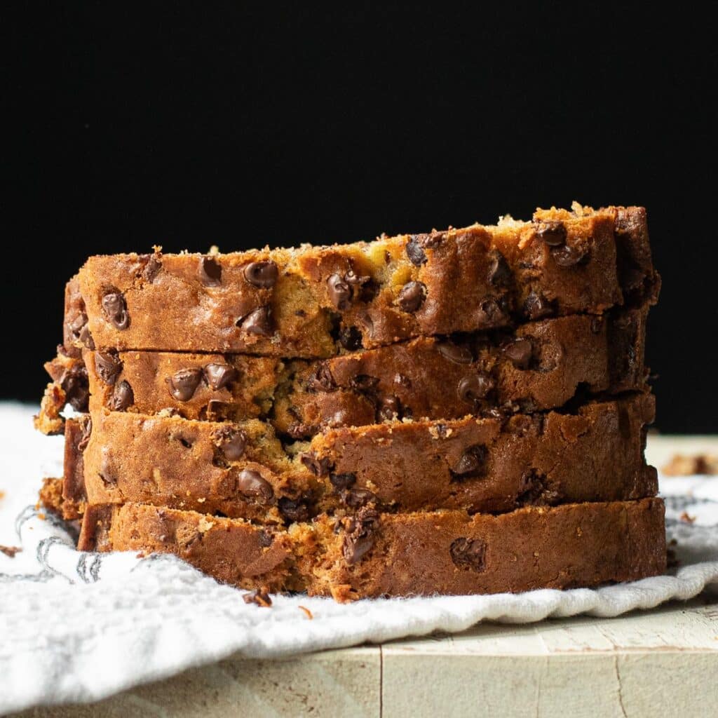 a stack of four slices of chocolate chip banana bread