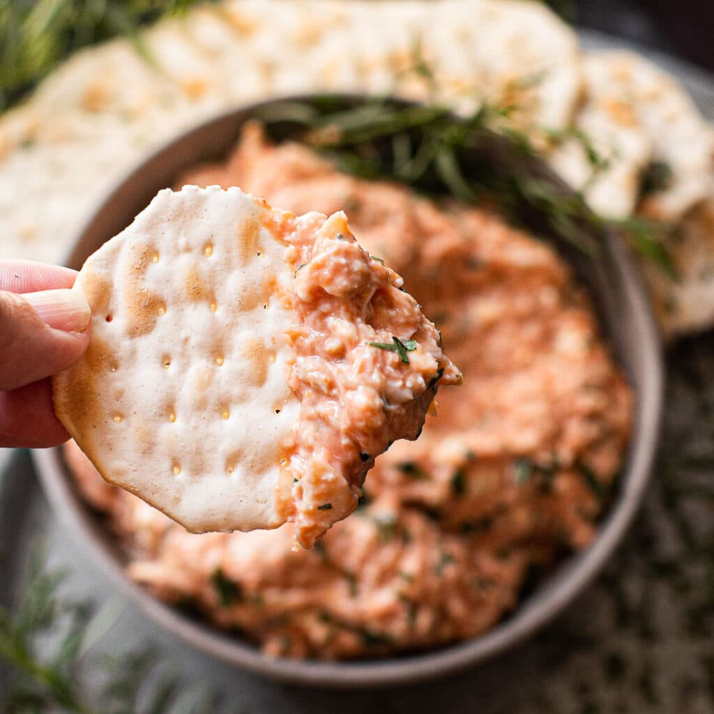 cold crab dip on a water cracker