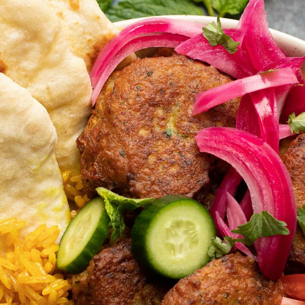 falafel ball with pickled onions and cucumbers