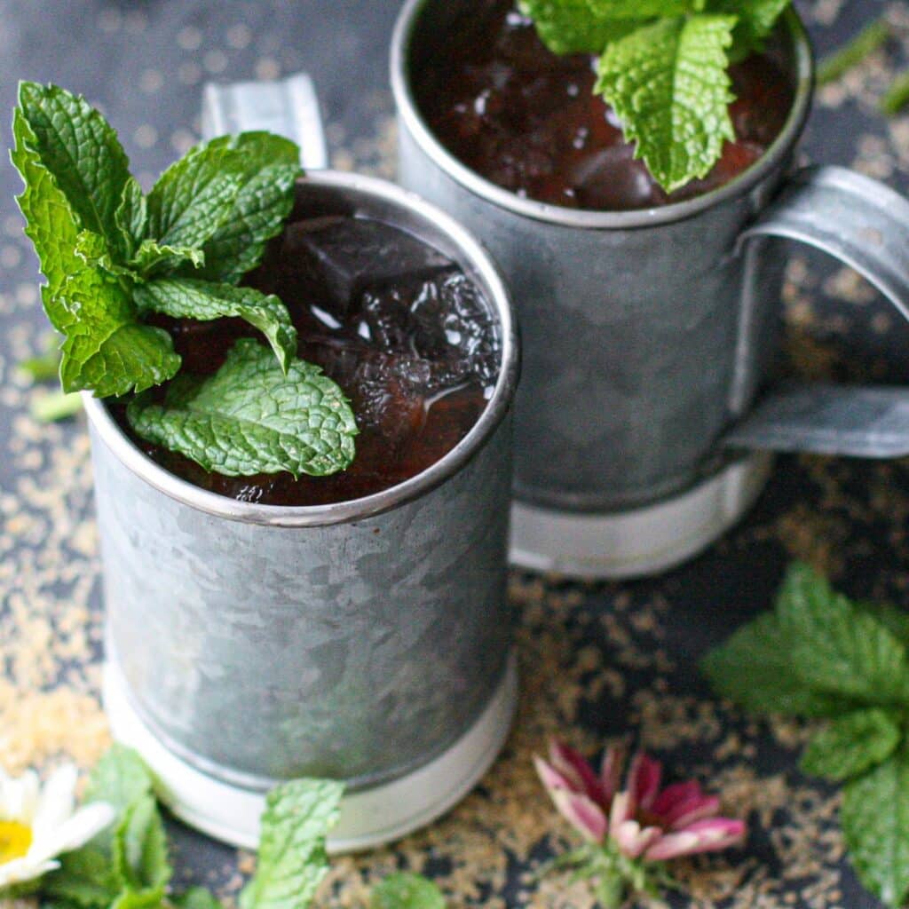 two mint juleps in pewter mint julep cups