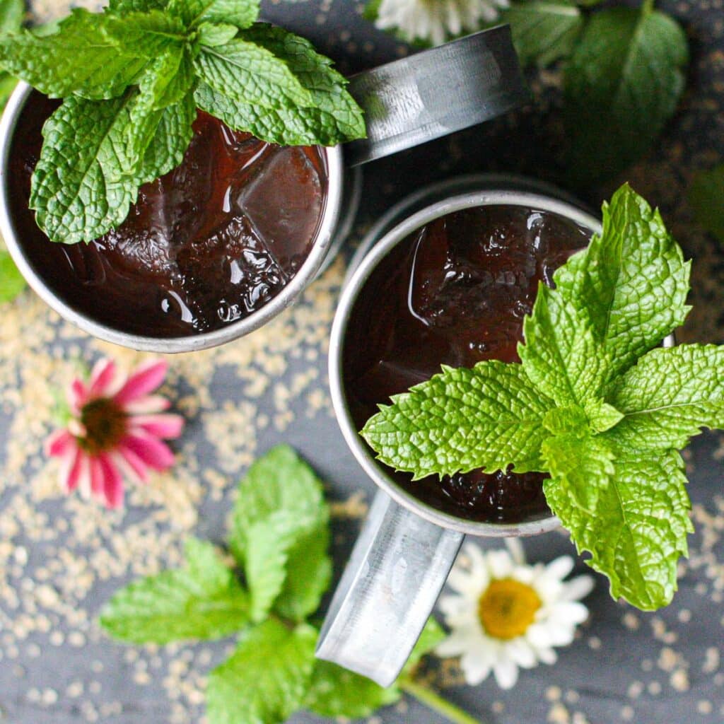 overhead view of two mint juleps garnished with fresh mint