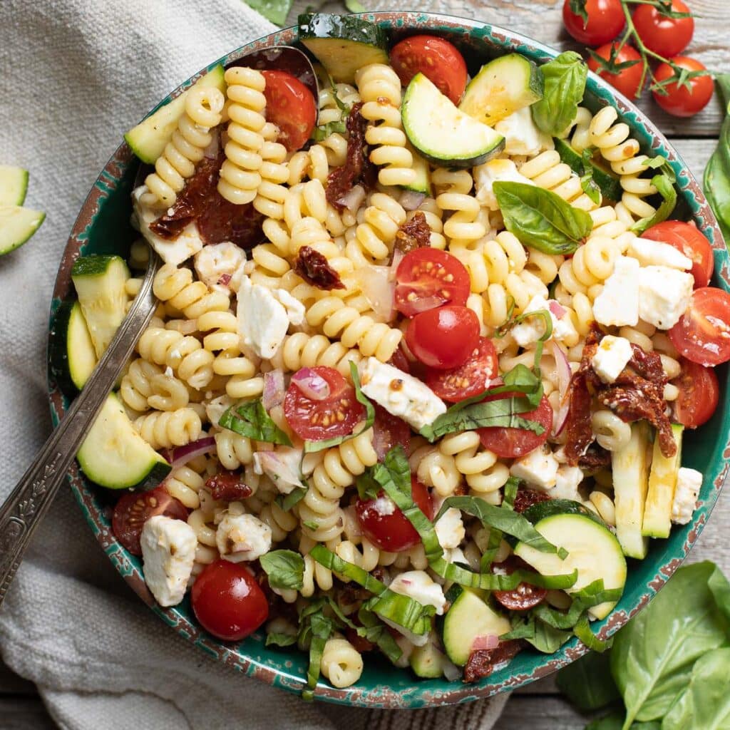 Mediterranean pasta salad with feta, tomatoes and zucchini