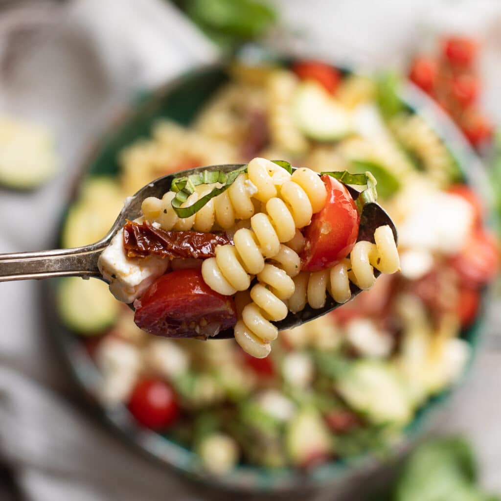A large spoonful of Mediterranean pasta salad