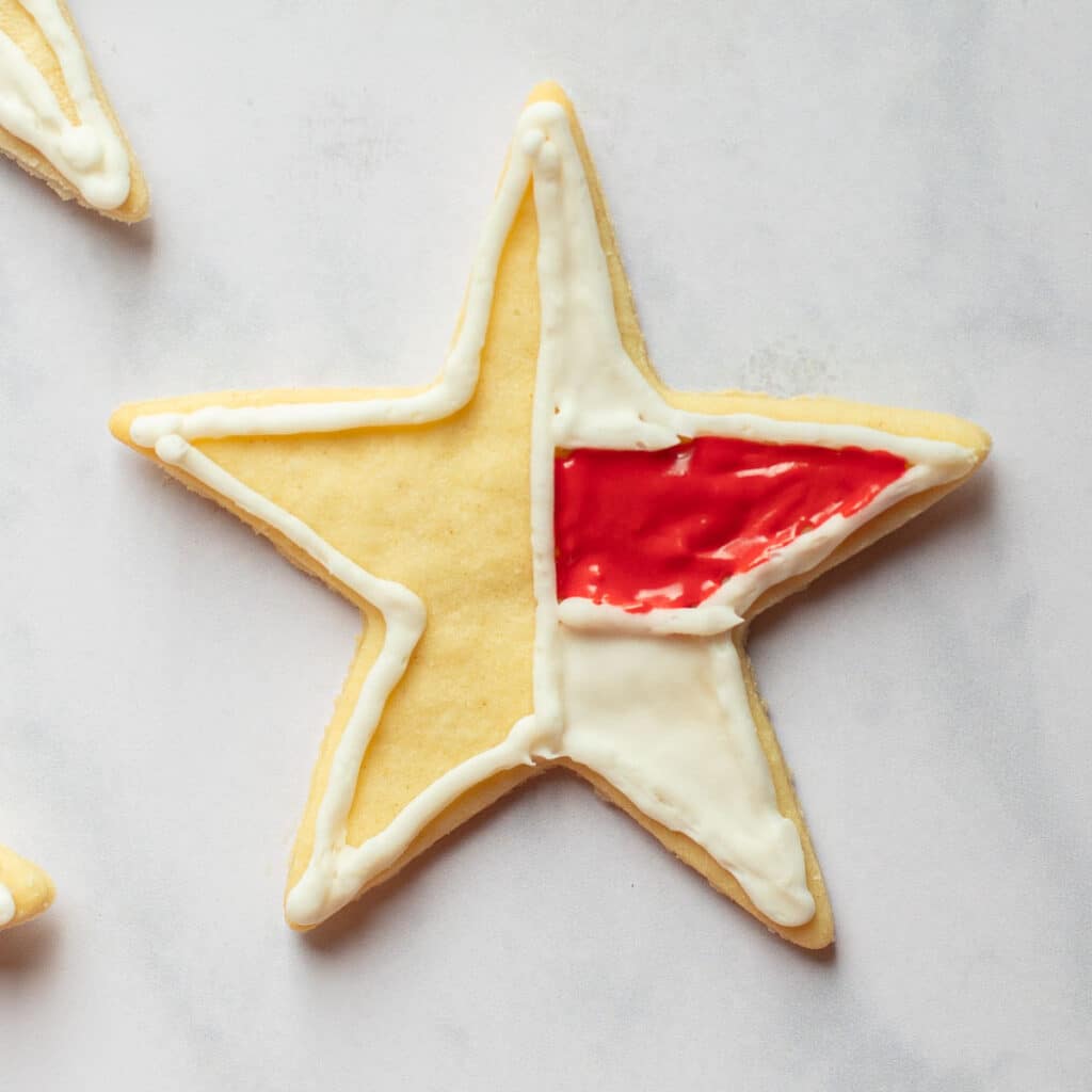 star sugar cookie with white and red icing