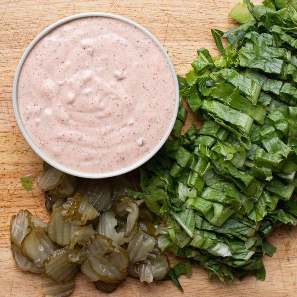 Remoulade sauce, shredded lettuce and dill pickle chips