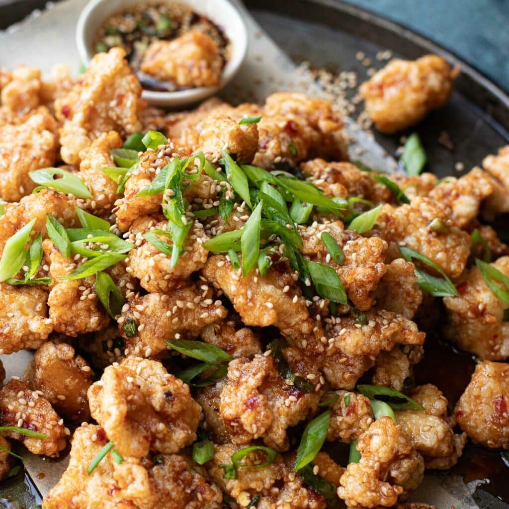 Hawaiian Korean fried chicken topped with scallions