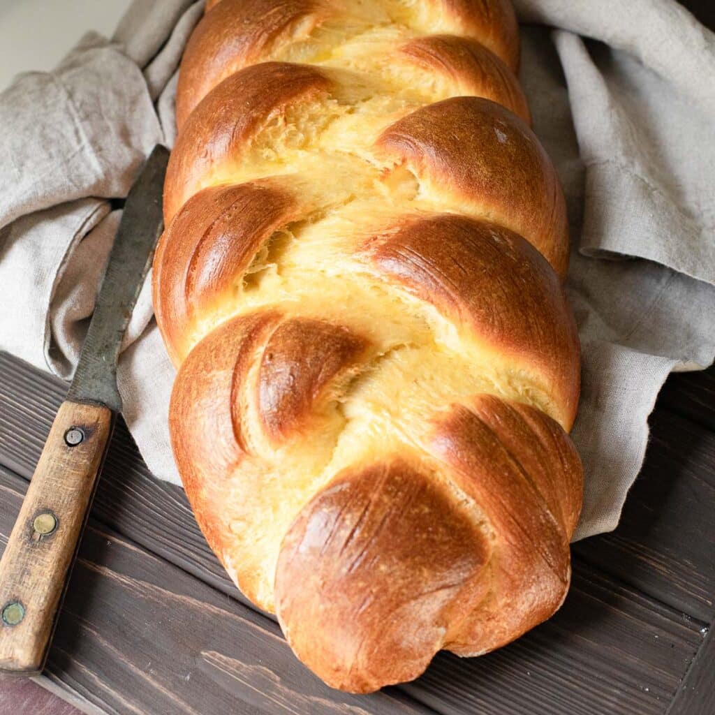 whole loaf of unsliced challah bread