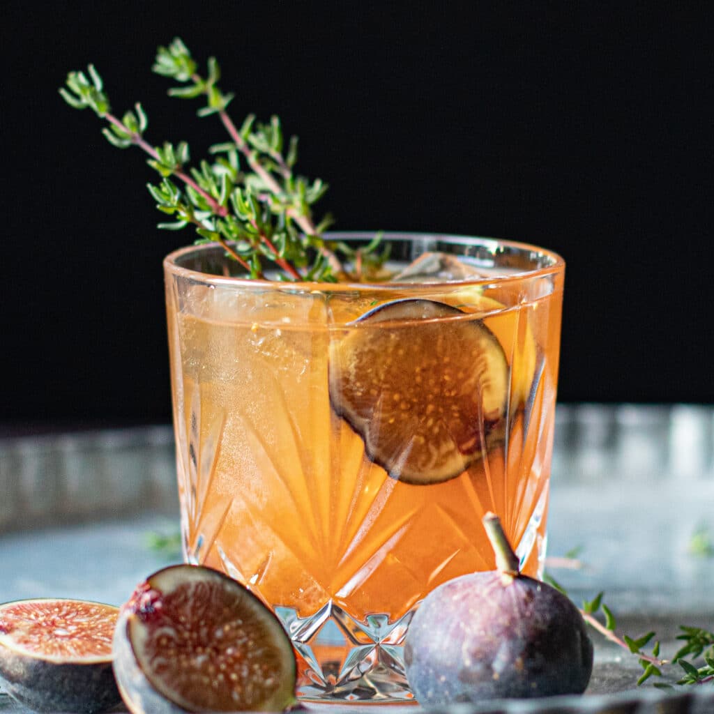 Fig Old Fashioned cocktail with fresh thyme
