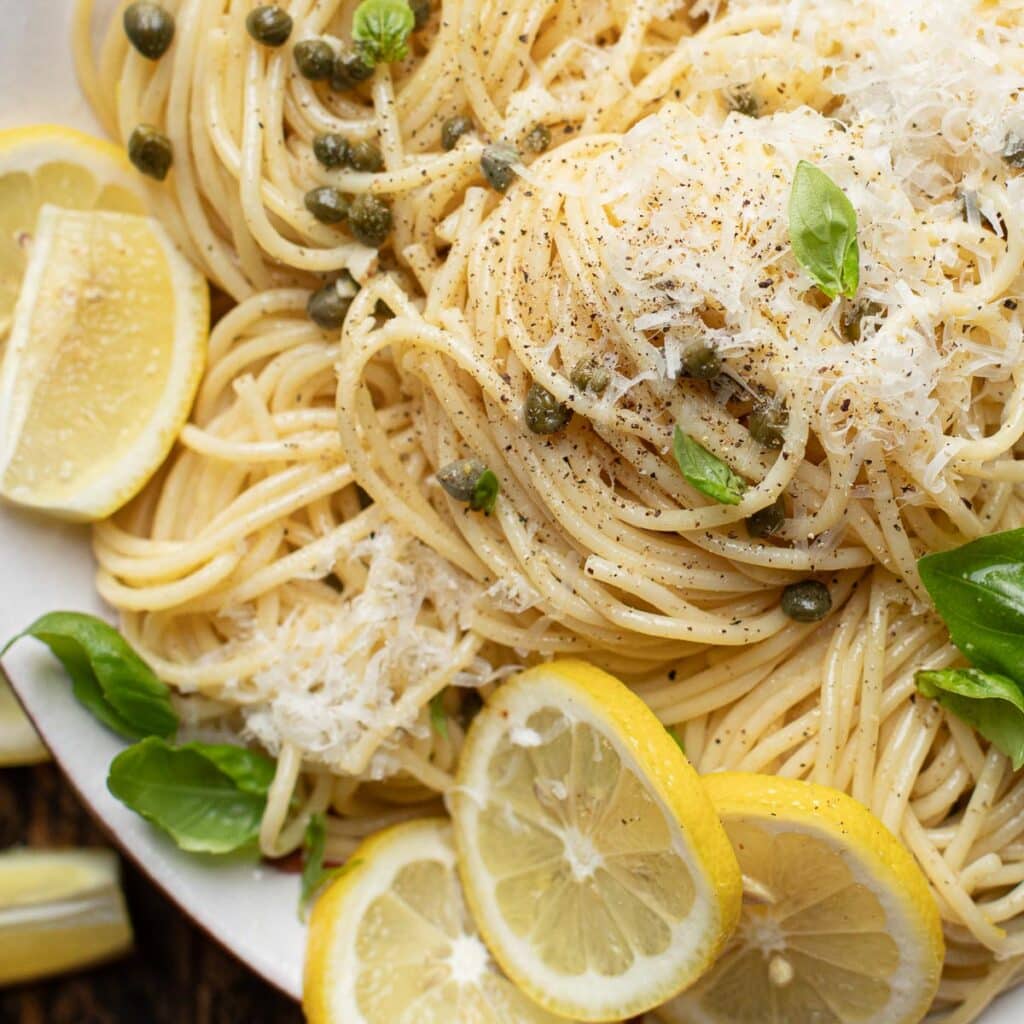 lemon caper pasta topped with Parmesan cheese and black pepper