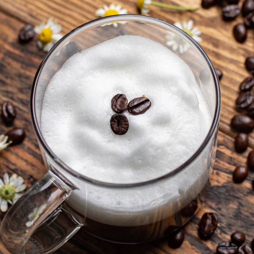 top down view of a mocha macchiato garnished with espresso beans