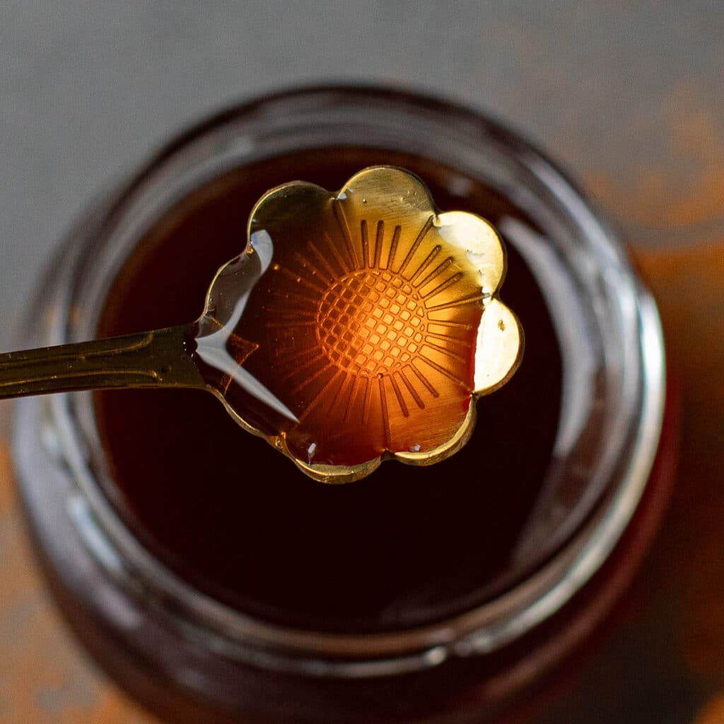 chai syrup on a gold spoon