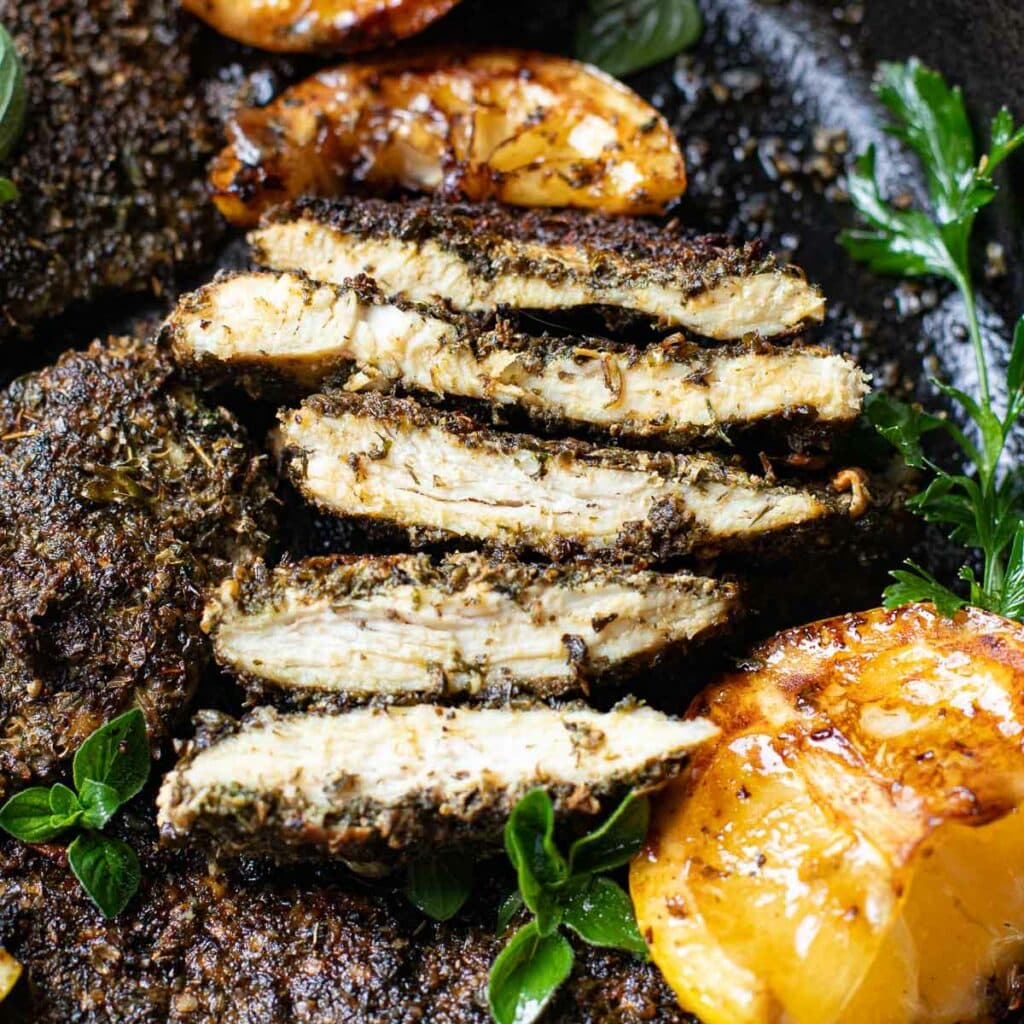sliced piece of herb crusted chicken