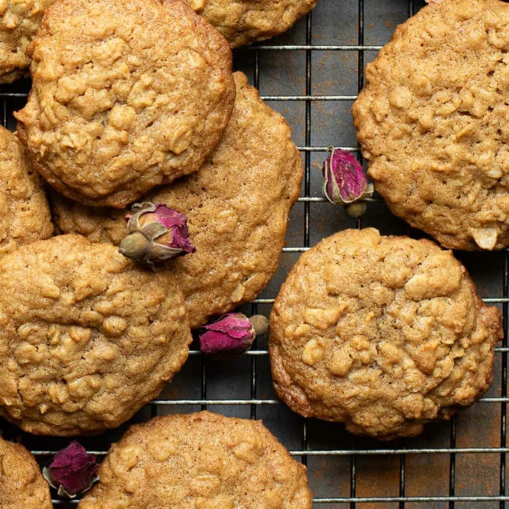 oatmeal cookies without butter on a wire rack with dried rose buds