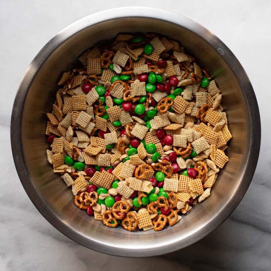 Christmas Chex mix in a large mixing bowl