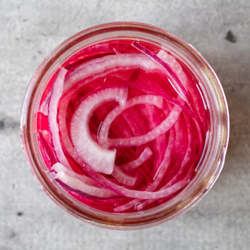 pickled onions in a glass jar