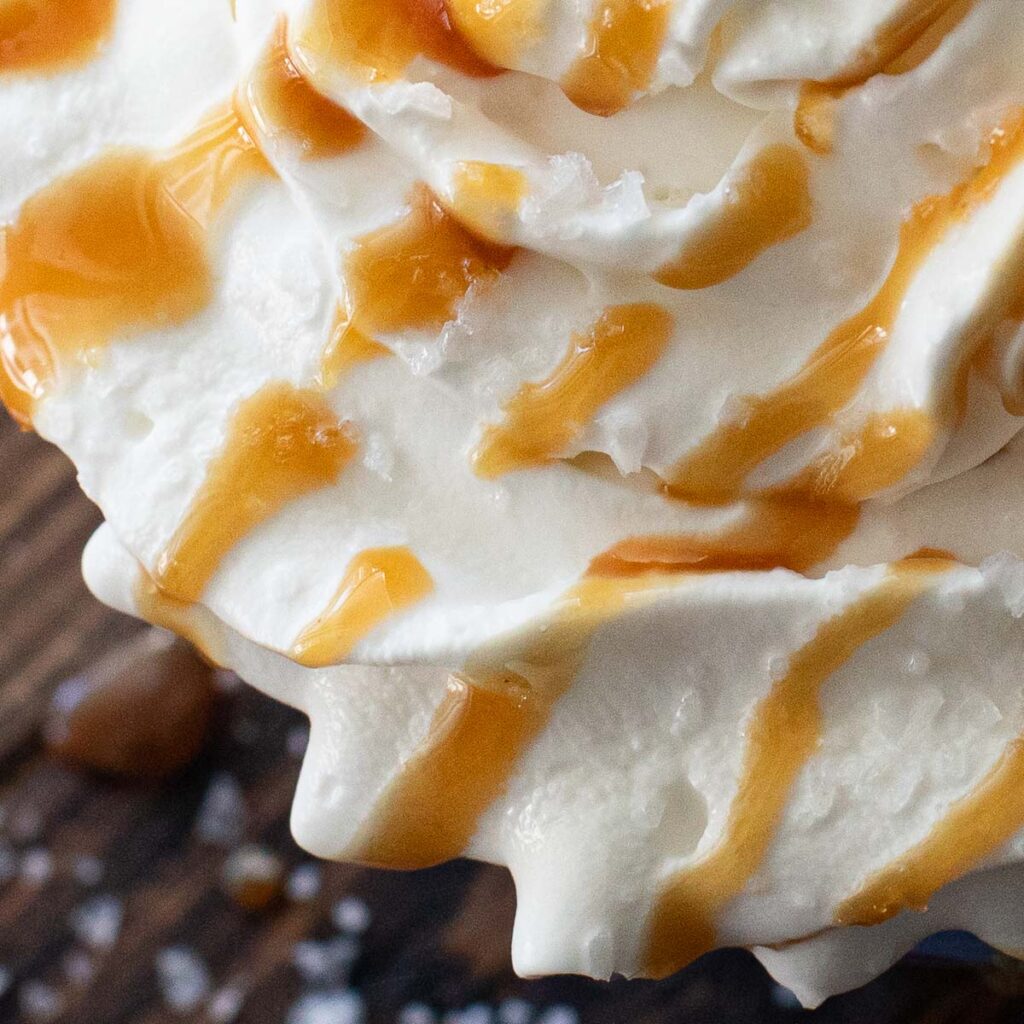 caramel sauce drizzled onto whipped cream