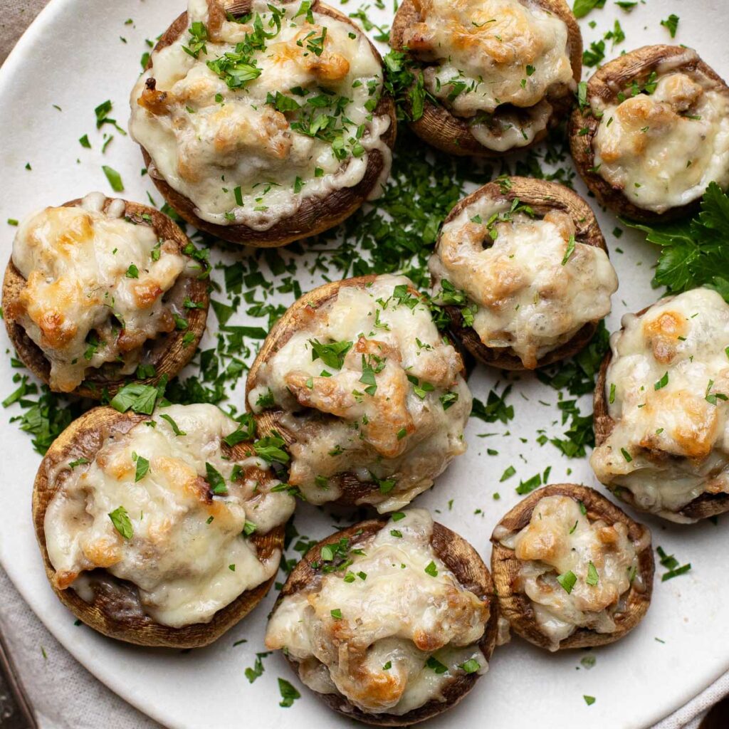 sausage stuffed mushrooms topped with fresh parsley