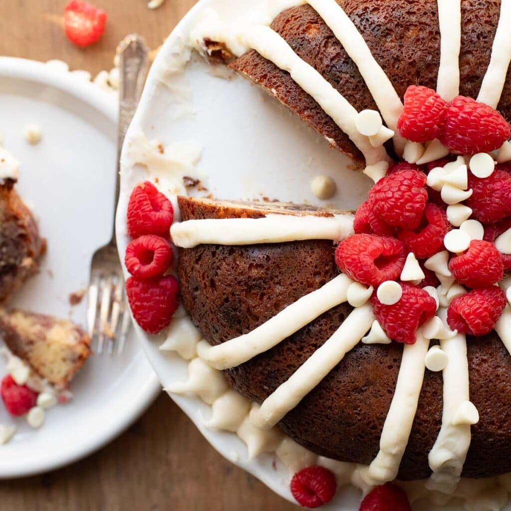 nothing bundt cakes white chocolate raspberry copycat recipe with one slice removed 